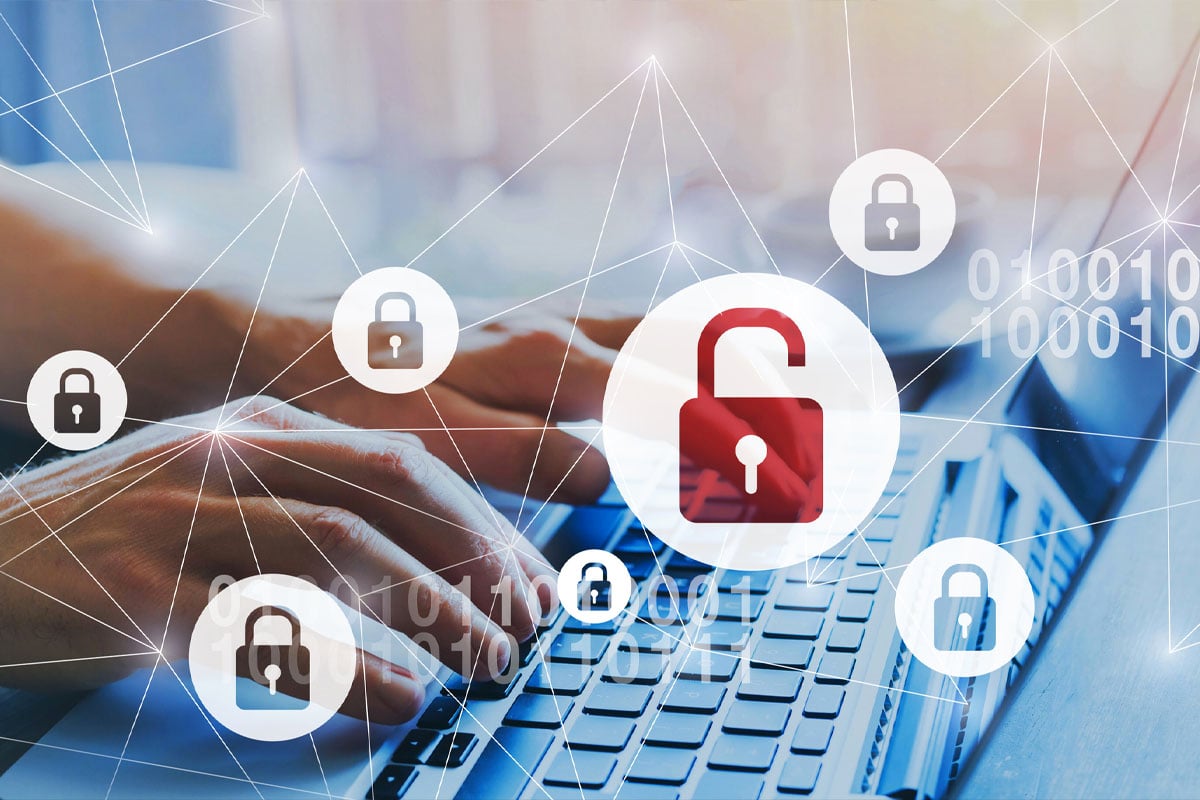 close up of person typing on a laptop with lock icons inside circles overlaid on top