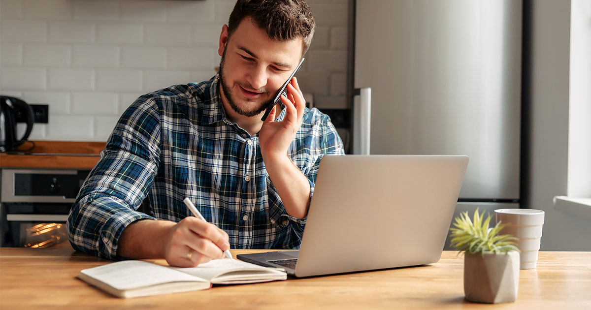 Man working at home in kitchen