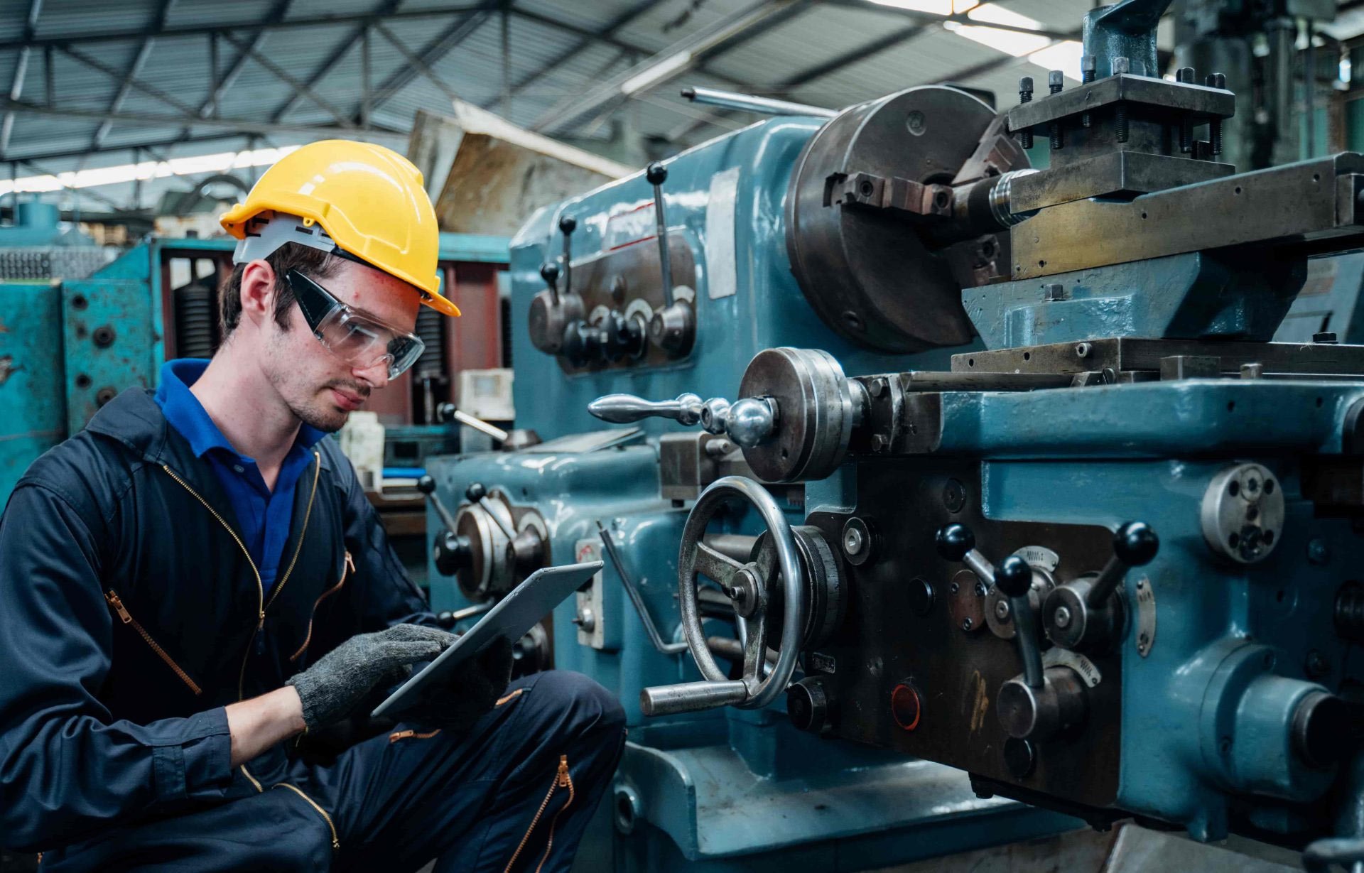 worker performing maintenance at facility